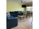 Living room features a sectional sofa and coffee table at 475 Benjamin Franklin Dr # 202, Sarasota, FL 34236