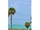 Breathtaking view of the ocean and palm trees from the balcony at 475 Benjamin Franklin Dr # 202, Sarasota, FL 34236