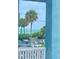 Stunning ocean view from balcony, featuring palm trees and beachfront parking at 475 Benjamin Franklin Dr # 202, Sarasota, FL 34236