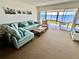 Living room with teal sectional and water views at 4767 Independence Dr # 4767, Bradenton, FL 34210