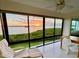 Relaxing sunroom with sunset view over the water at 4767 Independence Dr # 4767, Bradenton, FL 34210