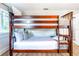 Bedroom with a wooden bunk bed at 5111 N Suwanee Ave, Tampa, FL 33603