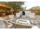 Cozy backyard with fire pit and built-in grill at 5111 N Suwanee Ave, Tampa, FL 33603