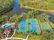 Community tennis and basketball courts with pool at 5156 Little Brook Ct, Sarasota, FL 34238