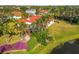 Backyard view of property, highlighting its landscaping and proximity to water at 5156 Little Brook Ct, Sarasota, FL 34238