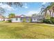 Large backyard with grassy area, offering privacy and tranquility at 5156 Little Brook Ct, Sarasota, FL 34238