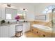 Bathroom with soaking tub, walk-in shower, and granite countertops at 5156 Little Brook Ct, Sarasota, FL 34238