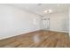 Spacious bedroom, featuring wood floors and a window with shutters at 5156 Little Brook Ct, Sarasota, FL 34238