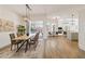 Open dining room with hardwood floors and a live edge table at 5156 Little Brook Ct, Sarasota, FL 34238