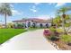 Luxury home with palm trees, manicured lawn, and circular driveway at 5156 Little Brook Ct, Sarasota, FL 34238