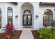 Double front doors with beveled glass and black frames at 5156 Little Brook Ct, Sarasota, FL 34238