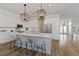 Modern kitchen with white cabinets, stainless steel appliances, and an island at 5156 Little Brook Ct, Sarasota, FL 34238