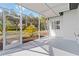 Screened lanai offers shaded seating and backyard views at 5156 Little Brook Ct, Sarasota, FL 34238