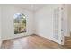 Bright office with wood floors and a large arched window at 5156 Little Brook Ct, Sarasota, FL 34238