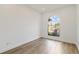 Sunlit office space featuring wood floors and a large window at 5156 Little Brook Ct, Sarasota, FL 34238