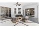 Covered patio with seating area, overlooking the pool at 5156 Little Brook Ct, Sarasota, FL 34238