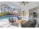 Relaxing pool and patio area with seating for entertaining at 5156 Little Brook Ct, Sarasota, FL 34238