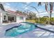 Inviting pool and spa with a screened enclosure at 5156 Little Brook Ct, Sarasota, FL 34238