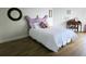 Bedroom features hardwood floors, and a large window at 5450 Eagles Point Cir # 405, Sarasota, FL 34231