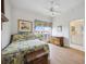 Guest bedroom with wood floors and ensuite bathroom access at 5450 Eagles Point Cir # 405, Sarasota, FL 34231