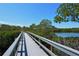 Scenic boardwalk path over tranquil waters at 5450 Eagles Point Cir # 405, Sarasota, FL 34231