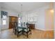 Elegant dining room featuring a glass-top table and hardwood floors at 5450 Eagles Point Cir # 405, Sarasota, FL 34231