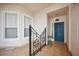 View of the building entrance featuring a secure door, tiled floor, and a bay window to the side at 5450 Eagles Point Cir # 405, Sarasota, FL 34231