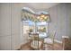 Kitchen breakfast nook with glass table and chairs at 5450 Eagles Point Cir # 405, Sarasota, FL 34231