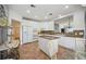 Spacious kitchen with granite countertops and white cabinets at 5450 Eagles Point Cir # 405, Sarasota, FL 34231