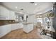 White kitchen with granite countertops and breakfast bar at 5450 Eagles Point Cir # 405, Sarasota, FL 34231