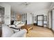 Open living room with built-in shelving and hardwood floors at 5450 Eagles Point Cir # 405, Sarasota, FL 34231
