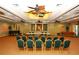Meeting room with hardwood floor, ceiling fans, projector and comfortable furnishings at 5450 Eagles Point Cir # 405, Sarasota, FL 34231