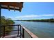 Serene view of calm water from a wooden deck at 5450 Eagles Point Cir # 405, Sarasota, FL 34231
