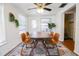 Bright dining room features a wood table, four chairs, and an area rug at 560 Bradenton Rd, Venice, FL 34293