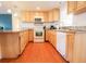 Bright kitchen with wood cabinets and granite countertops at 560 Bradenton Rd, Venice, FL 34293