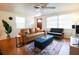 Bright living room with leather sofa and mid century modern decor at 560 Bradenton Rd, Venice, FL 34293