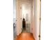 Bright hallway with wood floors and access to bedrooms at 560 Bradenton Rd, Venice, FL 34293