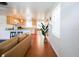 Open floor plan with hardwood floors and view into the kitchen at 560 Bradenton Rd, Venice, FL 34293