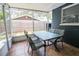 Screened porch with patio furniture, perfect for relaxing outdoors at 560 Bradenton Rd, Venice, FL 34293