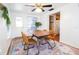 Dining area with wood table and four brown leather chairs at 560 Bradenton Rd, Venice, FL 34293