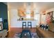 Open concept kitchen and living area, featuring a breakfast bar and hardwood floors at 560 Bradenton Rd, Venice, FL 34293