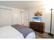 Bedroom with dresser, TV, and large closet at 560 Bradenton Rd, Venice, FL 34293