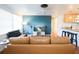 Living room with comfy leather couches and a large flat-screen TV at 560 Bradenton Rd, Venice, FL 34293