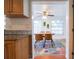 Kitchen view of dining room with table and chairs, and area rug at 560 Bradenton Rd, Venice, FL 34293