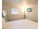 Bedroom with a TV, comfortable bed, and full-length mirror at 560 Bradenton Rd, Venice, FL 34293