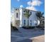 Two-story white house with palm trees and landscaping at 6008 Red Mangrove Ln, Bradenton, FL 34210