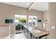 Spa-like bathroom with double vanity, granite countertops, and sliding glass doors leading to backyard at 7917 Broadmoor Pines Blvd, Sarasota, FL 34243