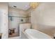 Spa-like bathroom with soaking tub and walk-in shower at 7917 Broadmoor Pines Blvd, Sarasota, FL 34243