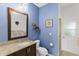 Bathroom with single vanity and access to the backyard at 7917 Broadmoor Pines Blvd, Sarasota, FL 34243