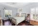 Bedroom with twin beds and plenty of natural light at 7917 Broadmoor Pines Blvd, Sarasota, FL 34243
